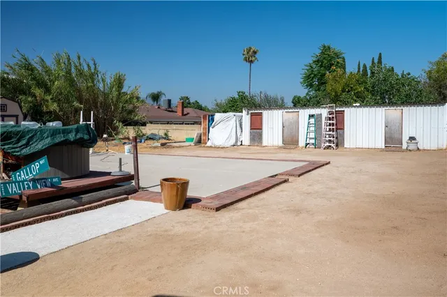 a view of a backyard with a sitting area