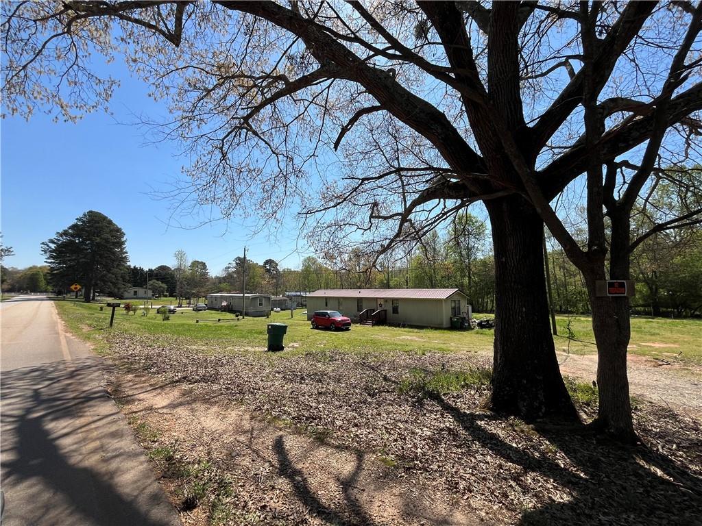 474 Whitney Road Jefferson, GA 30549 - Photo 12 of 55 a view of a yard with large trees