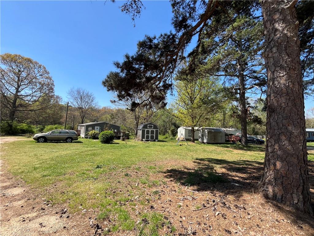 474 Whitney Road Jefferson, GA 30549 - Photo 13 of 55 a view of a yard with a house and a trees