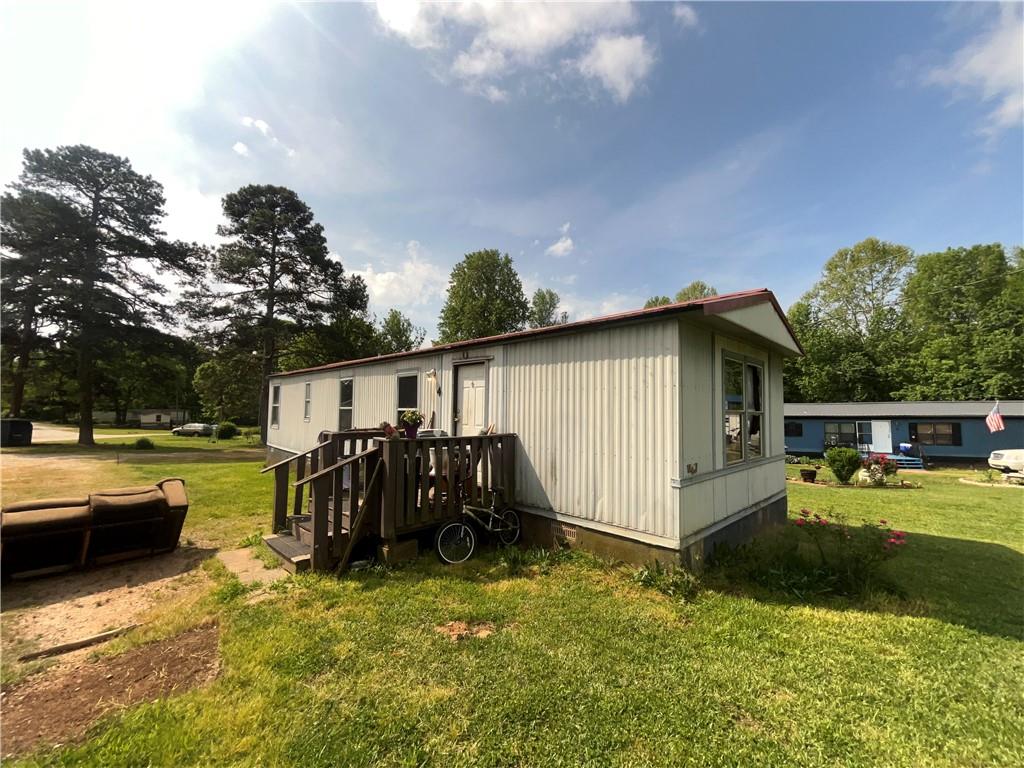474 Whitney Road Jefferson, GA 30549 - Photo 16 of 55 a view of a house with a yard and sitting area