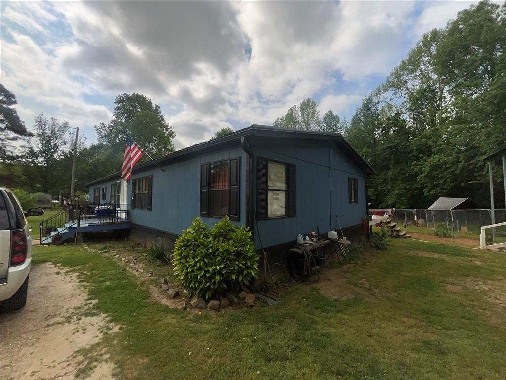 474 Whitney Road Jefferson, GA 30549 - Photo 21 of 55 a backyard of a house with yard barbeque oven and outdoor seating