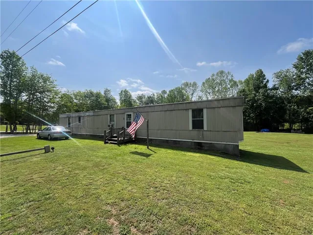 a view of a yard with a swimming pool
