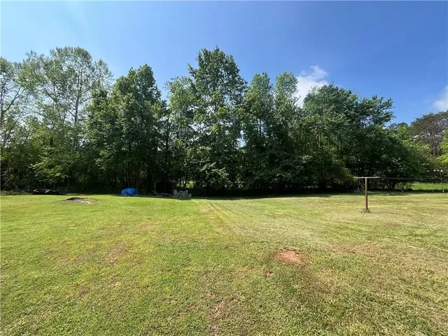 a fire hydrant in the middle of a field