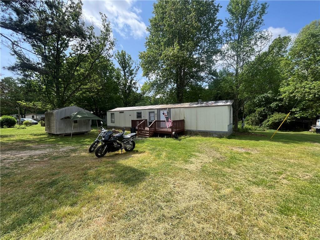 474 Whitney Road Jefferson, GA 30549 - Photo 32 of 55 a view of a house with backyard and sitting area