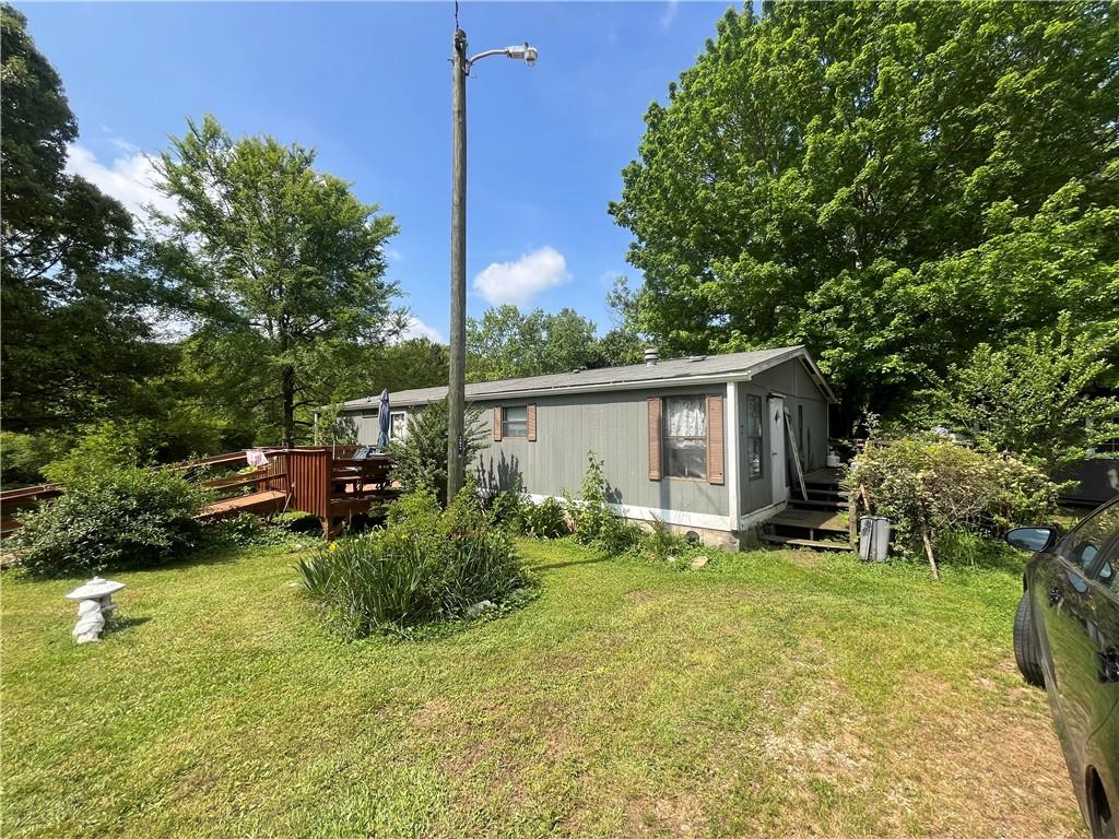 474 Whitney Road Jefferson, GA 30549 - Photo 34 of 55 a view of a house with backyard and sitting area