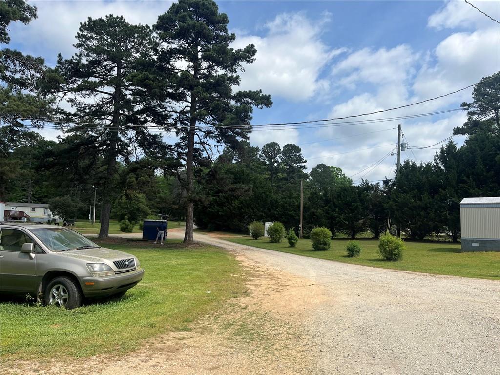 474 Whitney Road Jefferson, GA 30549 - Photo 35 of 55 a front view of a house with garden