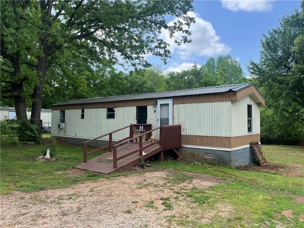 474 Whitney Road Jefferson, GA 30549 - Photo 42 of 55 a view of a house with a yard and a large tree