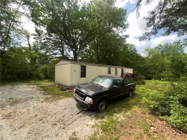 a yellow swimming pool is in the middle of a lake