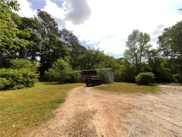 a view of a park with large trees
