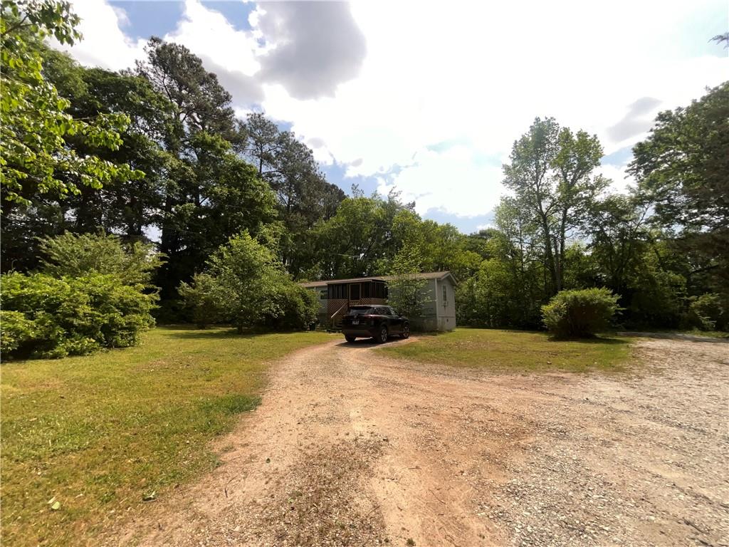 474 Whitney Road Jefferson, GA 30549 - Photo 48 of 55 a backyard of a house with lots of green space