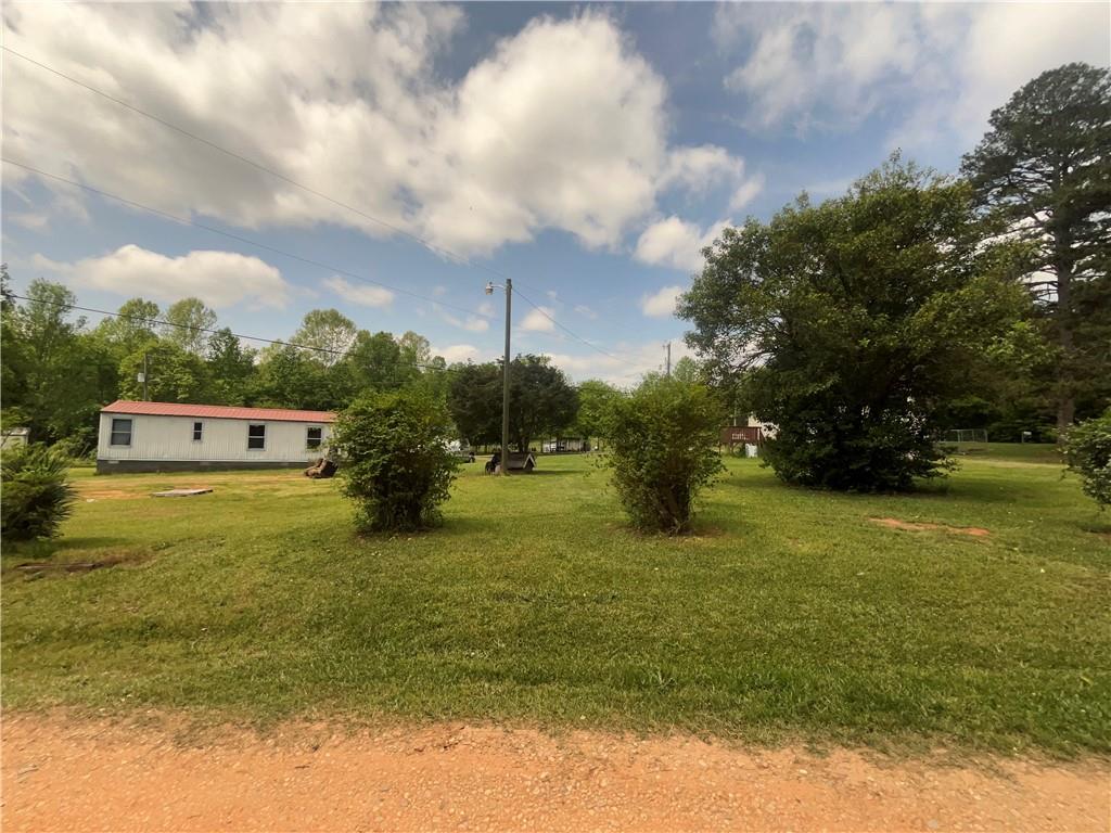 474 Whitney Road Jefferson, GA 30549 - Photo 49 of 55 a yellow swimming pool is in the middle of a lake