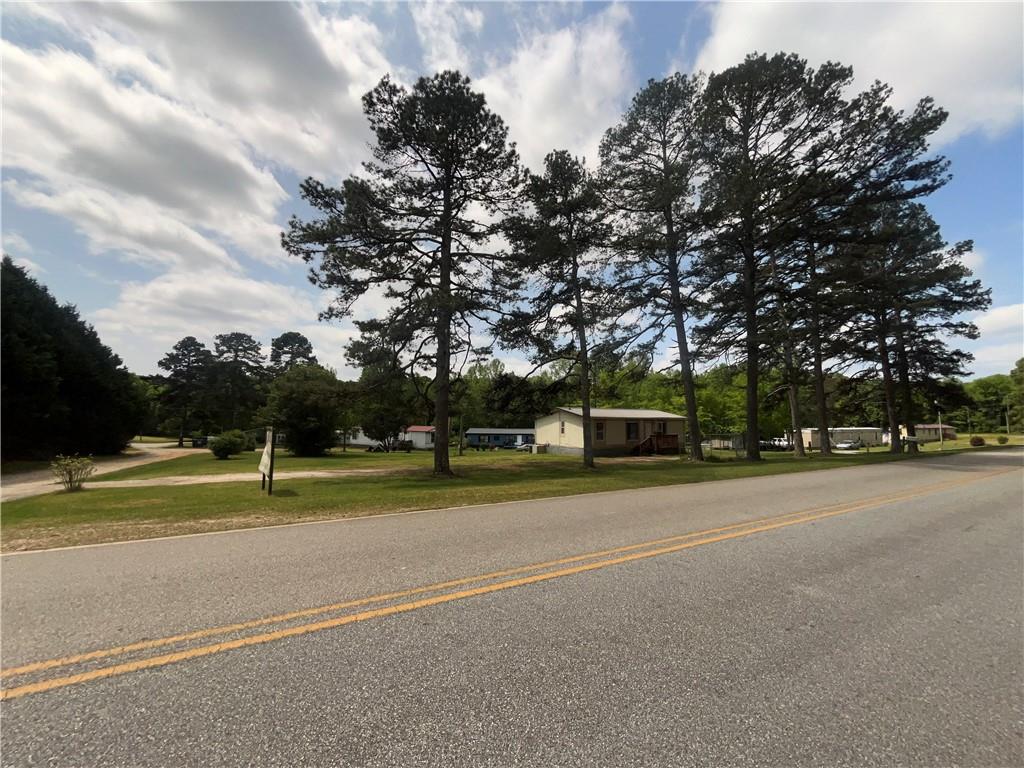 474 Whitney Road Jefferson, GA 30549 - Photo 52 of 55 a view of a tennis ground with large trees