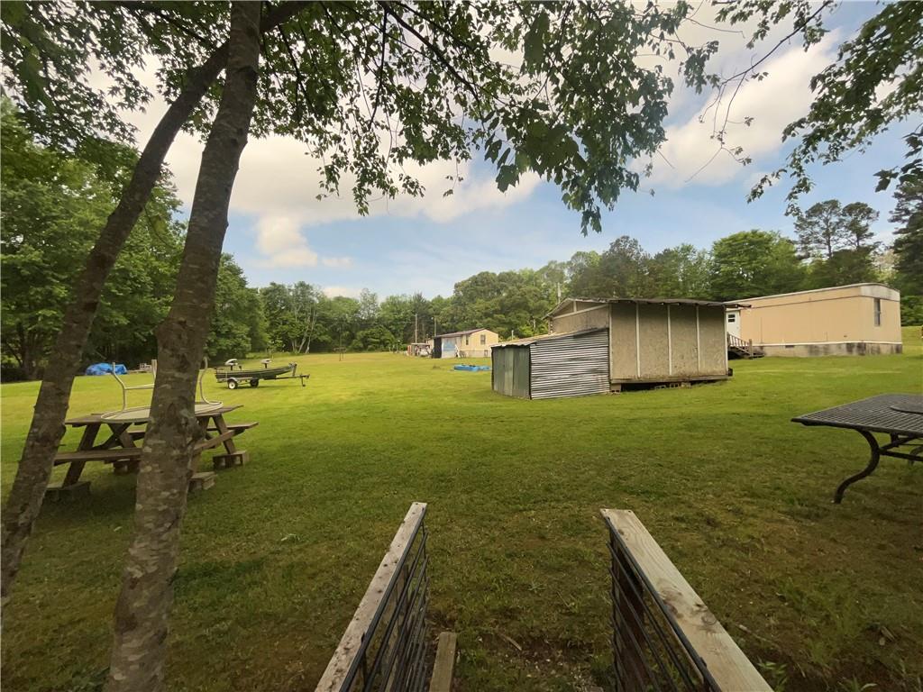 474 Whitney Road Jefferson, GA 30549 - Photo 6 of 55 a view of a lake with a big yard