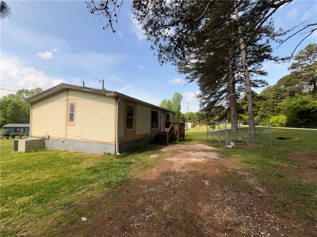 474 Whitney Road Jefferson, GA 30549 - Photo 9 of 55 a view of a house with backyard and trees