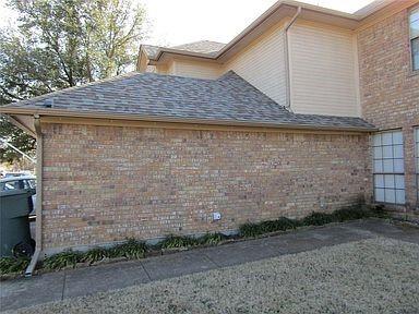 1500 North Grant Drive, Unit A Sherman, TX 75092 - Photo 14 of 14 a side view of a house with a yard