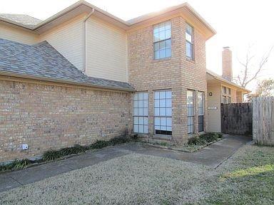 1500 North Grant Drive, Unit A Sherman, TX 75092 - Photo 2 of 14 a front view of a house with a yard