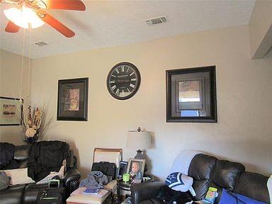 1500 North Grant Drive, Unit A Sherman, TX 75092 - Photo 7 of 14 a living room with furniture and a window