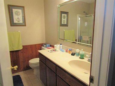 1500 North Grant Drive, Unit A Sherman, TX 75092 - Photo 8 of 14 a bathroom with a sink and a mirror