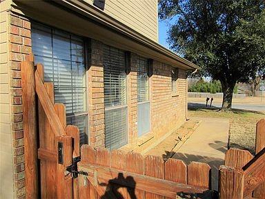 1500 North Grant Drive, Unit A Sherman, TX 75092 - Photo 9 of 14 a view of a house with a yard