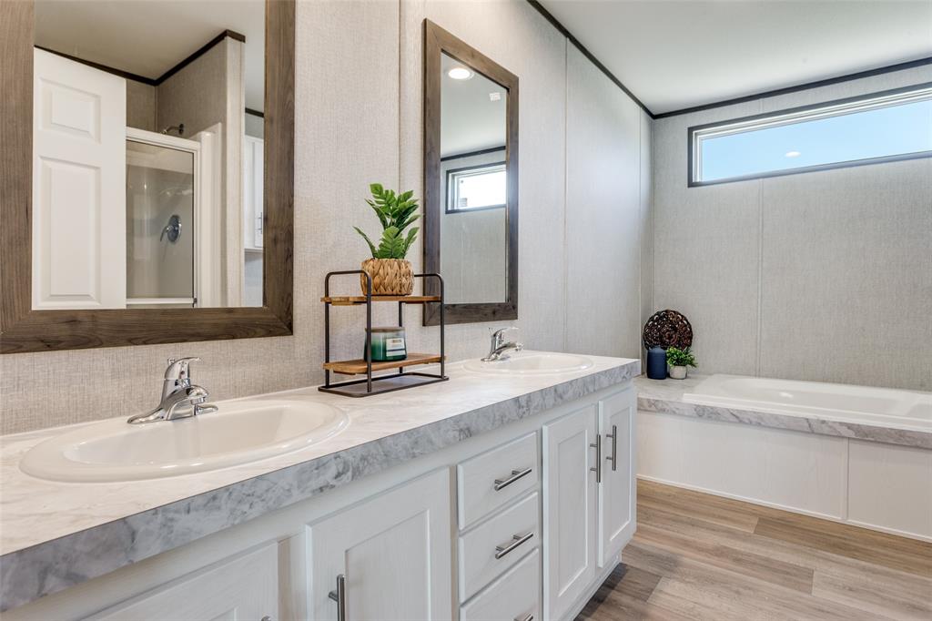 175 Cedar Drive Azle, TX 76020 - Photo 19 of 25 a bathroom with a sink and a mirror