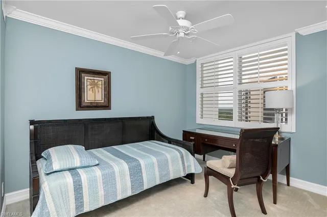 a bedroom with a bed and a table