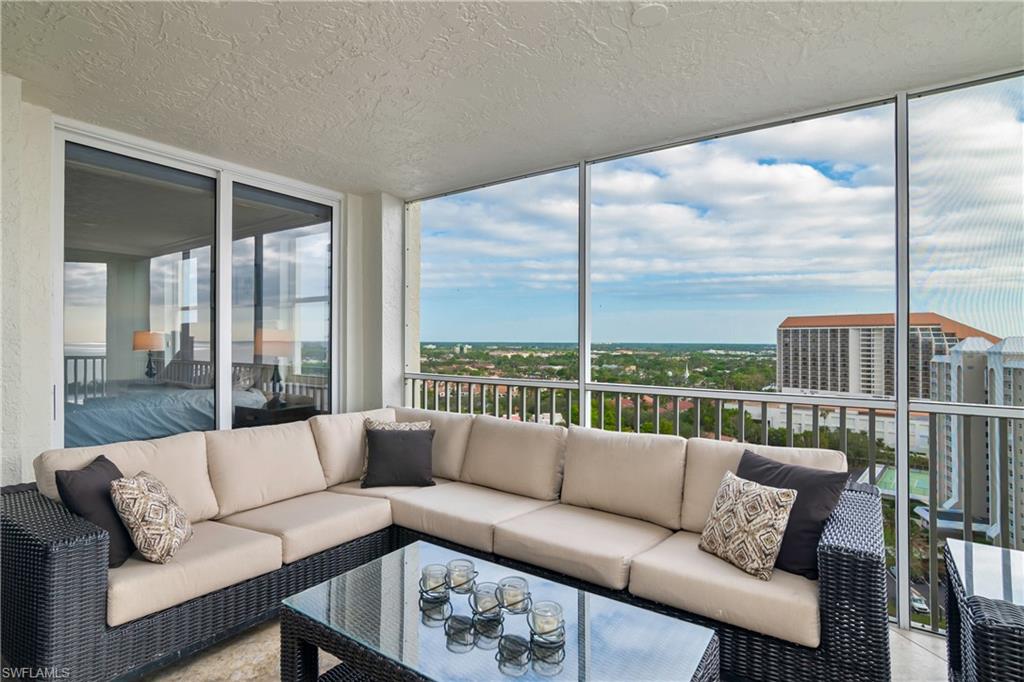 5550 Heron Point Drive, Unit 1804 Naples, FL 34108 - Photo 15 of 20 a living room with furniture view and large windows