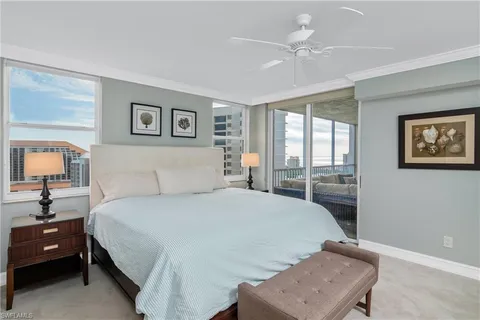 a bedroom with a bed window and wall painting