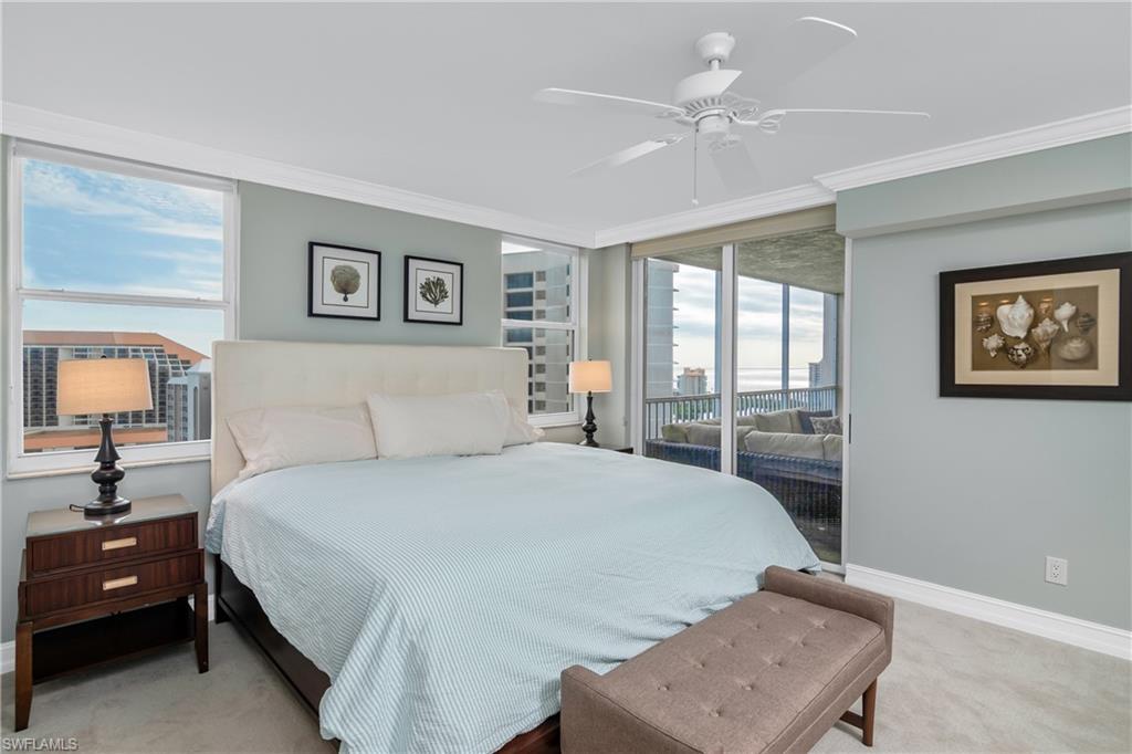 5550 Heron Point Drive, Unit 1804 Naples, FL 34108 - Photo 9 of 20 a bedroom with a bed window and wall painting