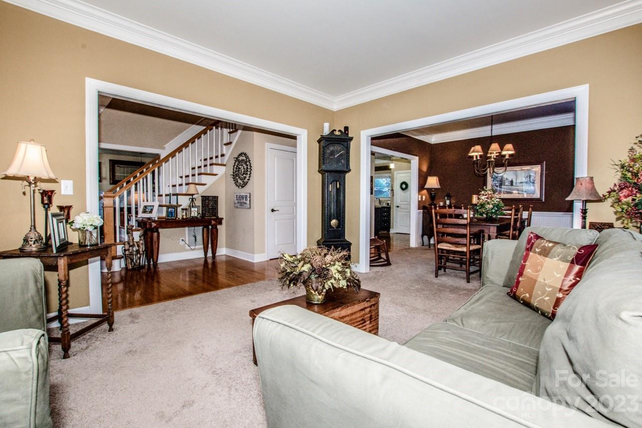 17506 Springwinds Drive Cornelius, NC 28031 - Photo 11 of 35 a living room with furniture and large mirror