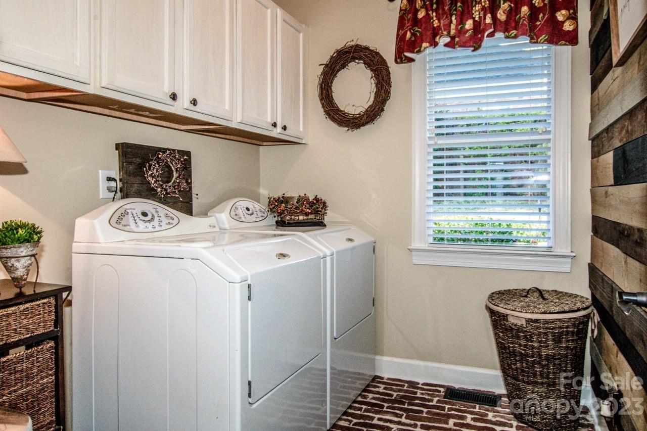 17506 Springwinds Drive Cornelius, NC 28031 - Photo 15 of 35 a utility room with dryer and washer