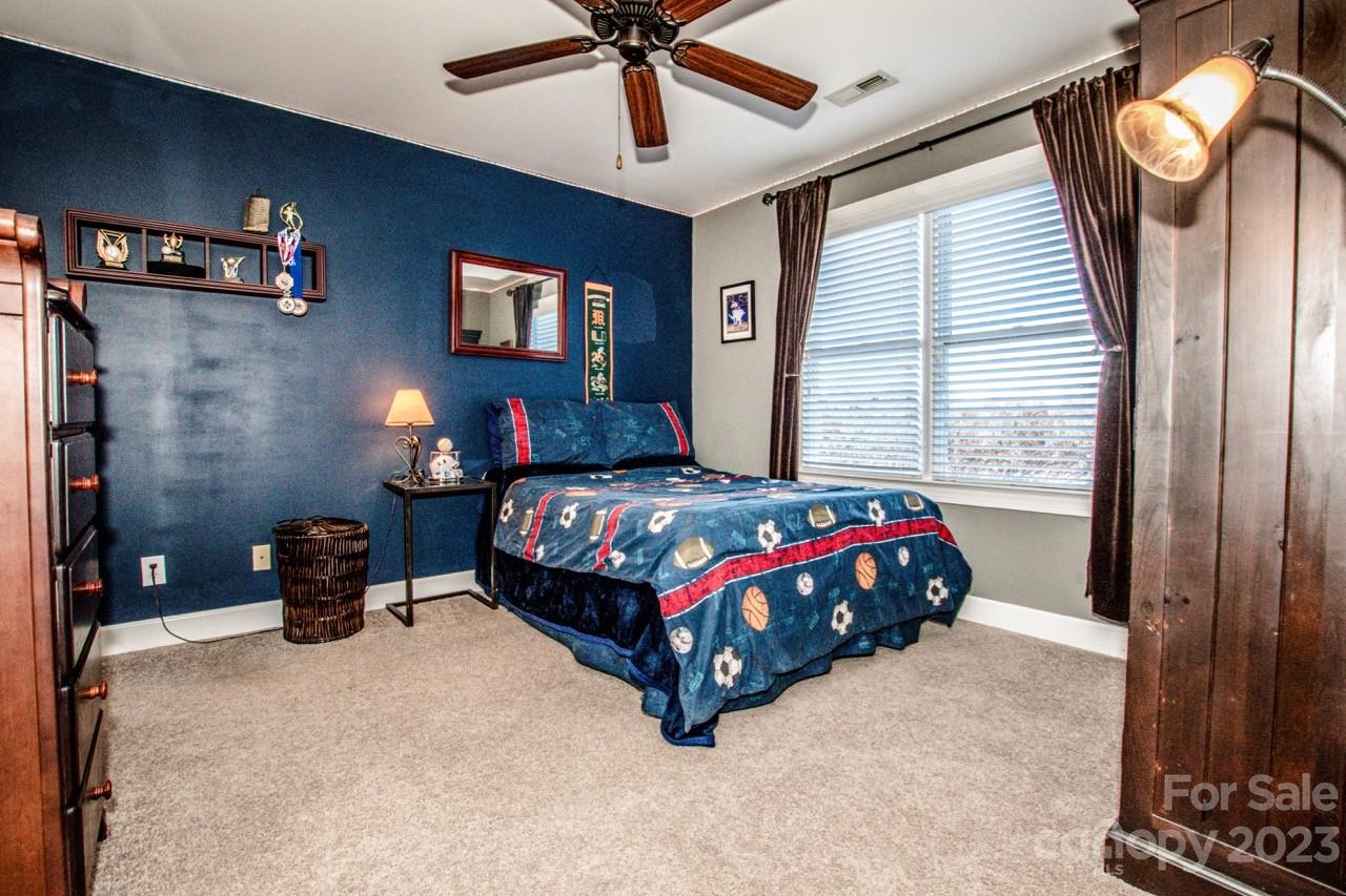 17506 Springwinds Drive Cornelius, NC 28031 - Photo 20 of 35 a bedroom with a bed and window