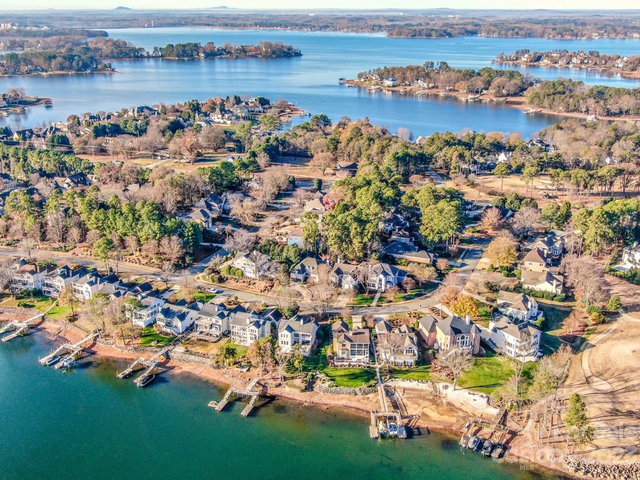 17506 Springwinds Drive Cornelius, NC 28031 - Photo 2 of 35 an aerial view of residential houses with outdoor space and lake view