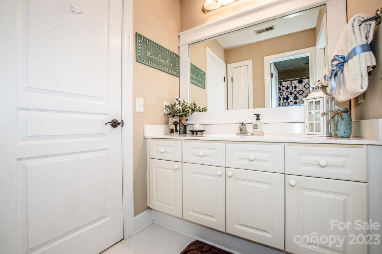 17506 Springwinds Drive Cornelius, NC 28031 - Photo 21 of 35 a bathroom with a sink and a mirror
