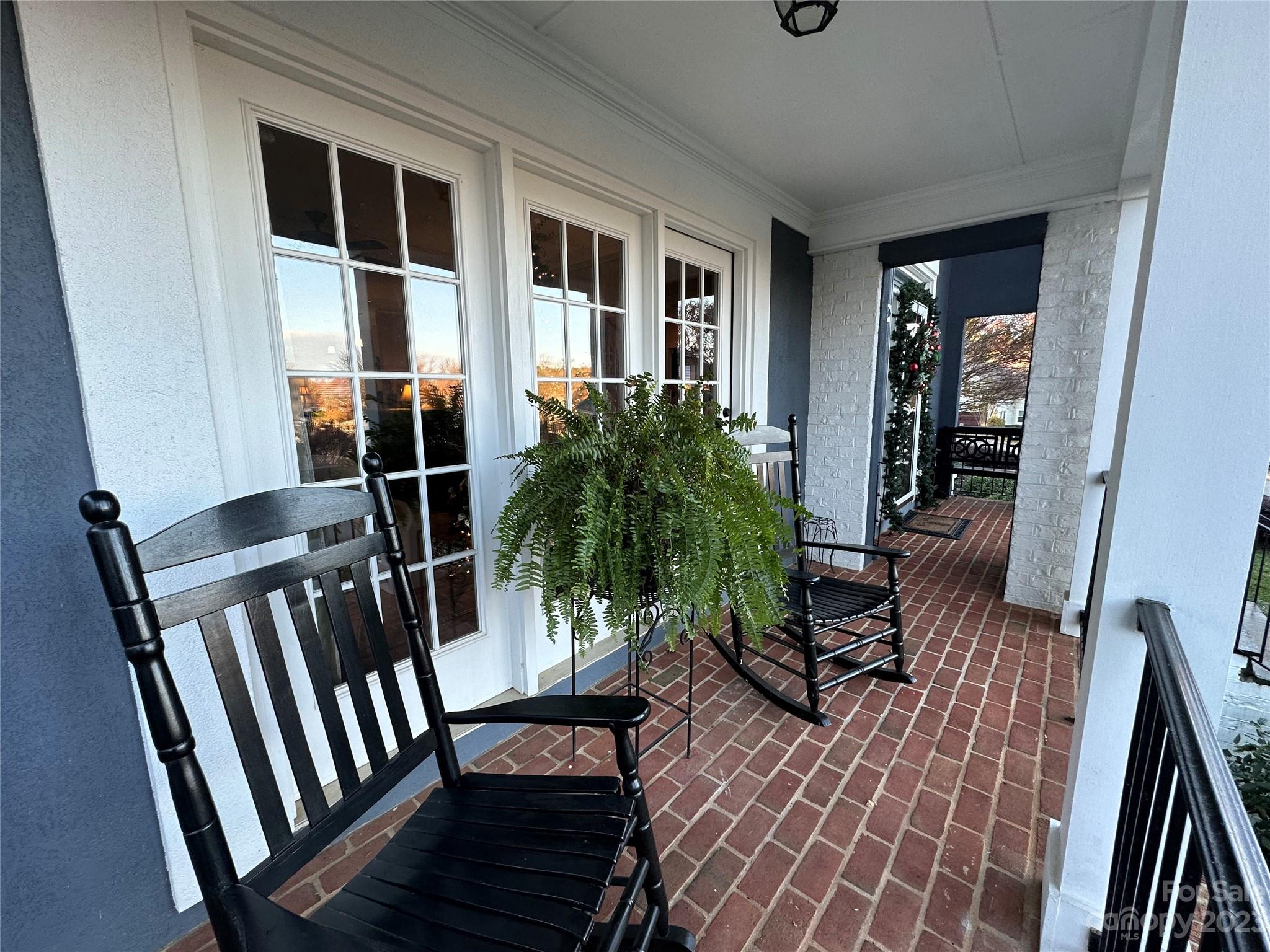 17506 Springwinds Drive Cornelius, NC 28031 - Photo 26 of 35 a living room with furniture and a potted plant