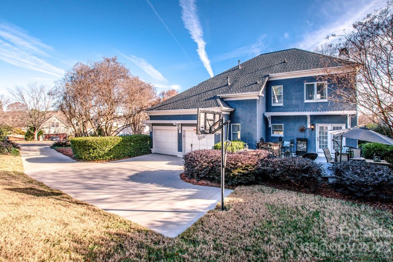17506 Springwinds Drive Cornelius, NC 28031 - Photo 31 of 35 a front view of a house with garden