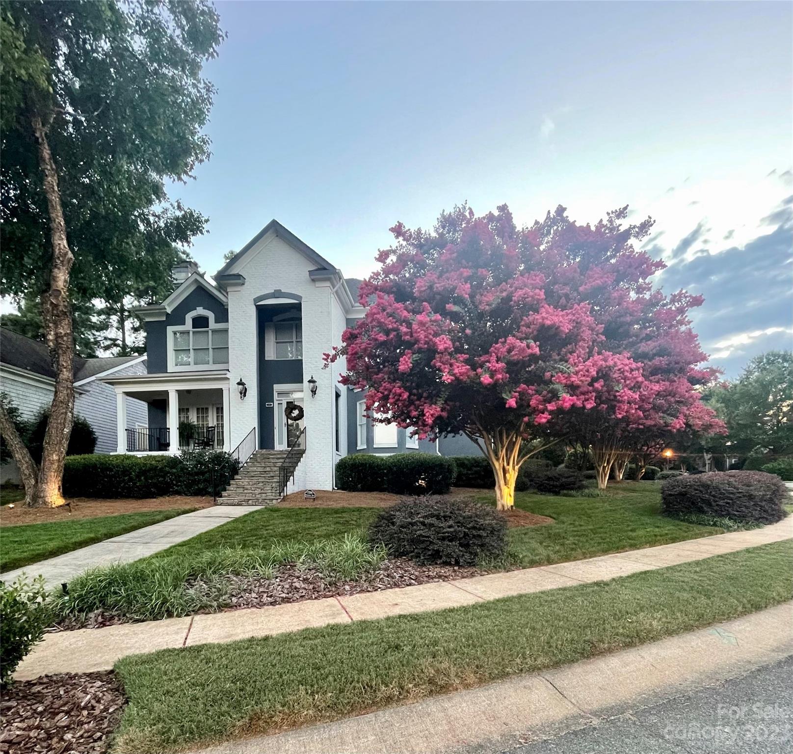 17506 Springwinds Drive Cornelius, NC 28031 - Photo 34 of 35 a front view of a house with a garden