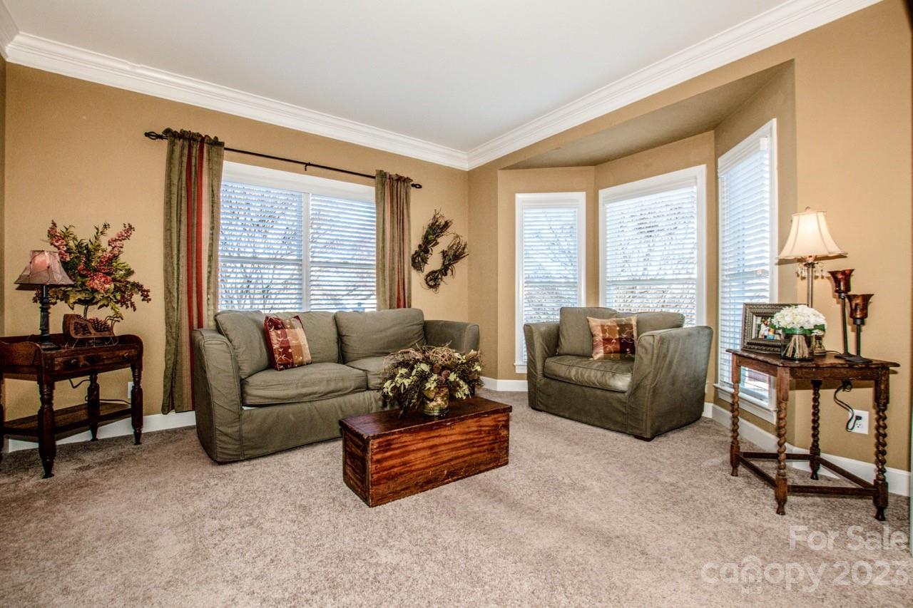 17506 Springwinds Drive Cornelius, NC 28031 - Photo 10 of 35 a living room with furniture and a large window