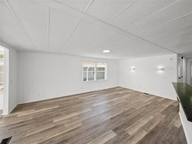 a view of kitchen with wooden floor