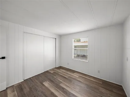 a bathroom with a sink toilet and mirror
