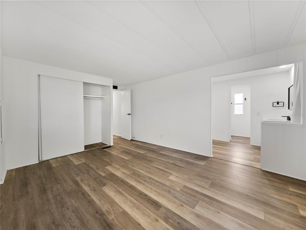 1610 Reynolds Road, Unit 35 Lakeland, FL 33801 - Photo 29 of 59 a view of empty room with wooden floor