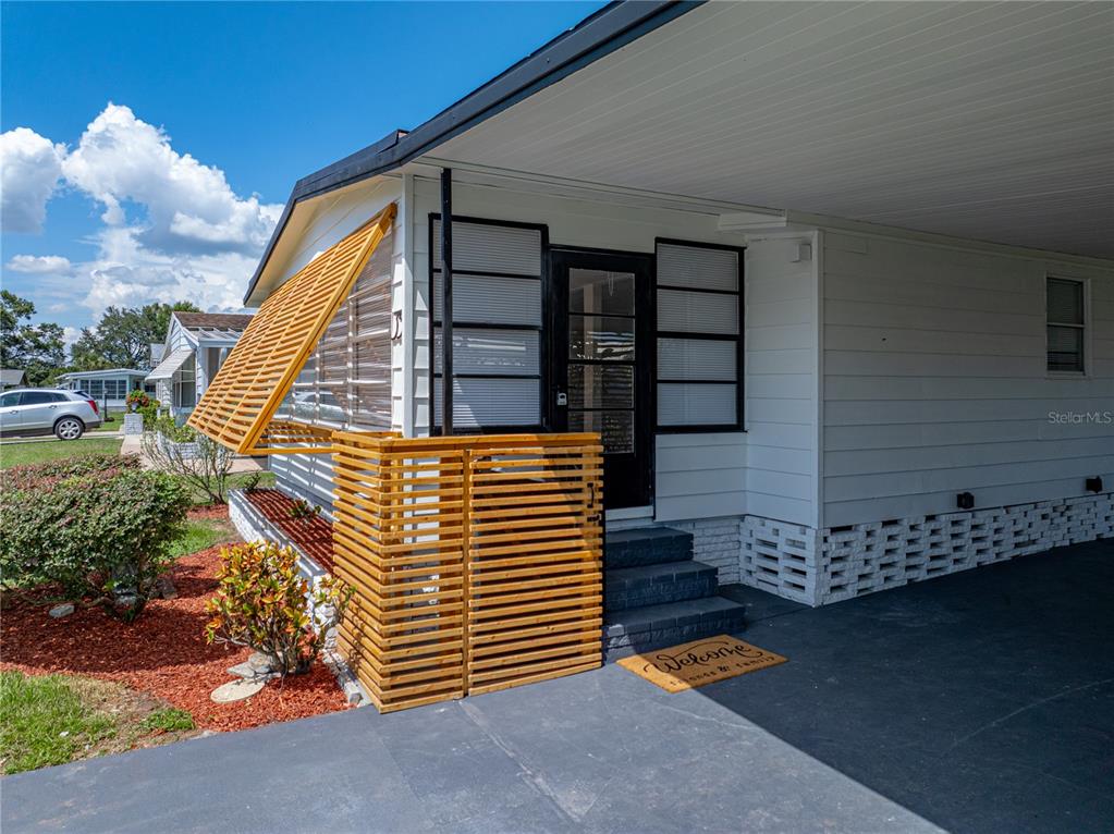 1610 Reynolds Road, Unit 35 Lakeland, FL 33801 - Photo 3 of 59 a front view of a house with entryway