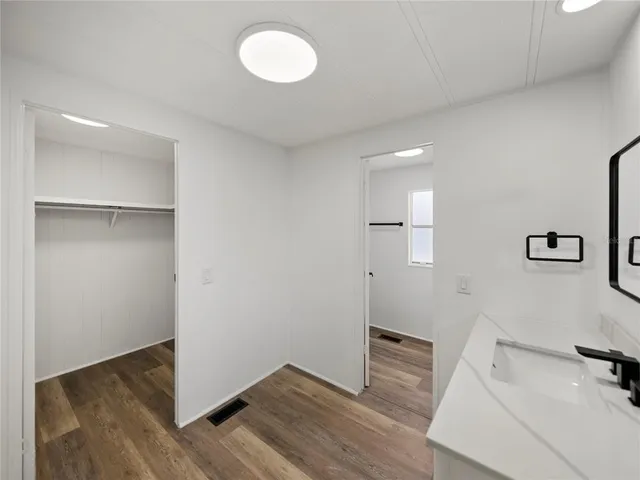 a bathroom with a glass shower door