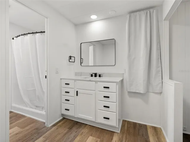 a white toilet sitting next to a shower