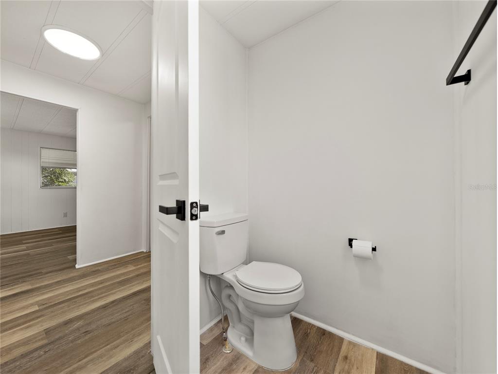 1610 Reynolds Road, Unit 35 Lakeland, FL 33801 - Photo 35 of 59 a white toilet sitting next to a shower