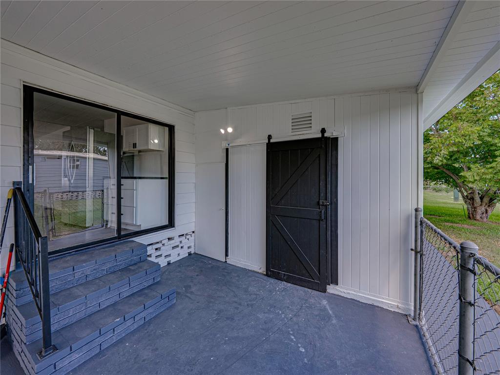 1610 Reynolds Road, Unit 35 Lakeland, FL 33801 - Photo 41 of 59 a view of an empty room with a fireplace and a window