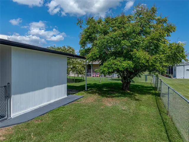 a view of a back yard of the house