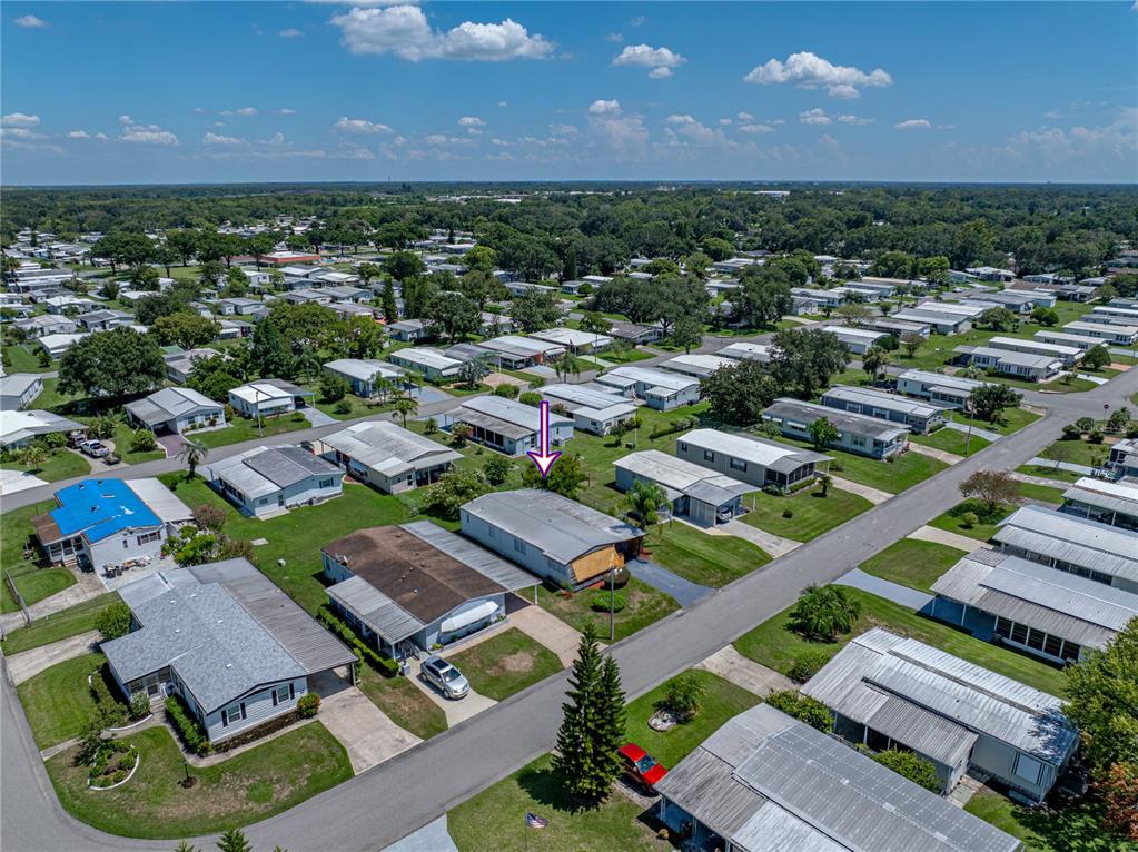 1610 Reynolds Road, Unit 35 Lakeland, FL 33801 - Photo 57 of 59 an aerial view of a city with lots of residential buildings and mountain view in back