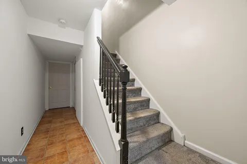 a view of a hallway with stairs