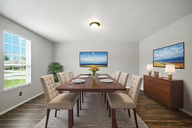 a view of a dining room with furniture window and wooden floor