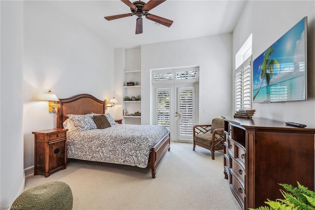 837 Barcarmil Way Naples, FL 34110 - Photo 23 of 38 a bedroom with a bed furniture and a window